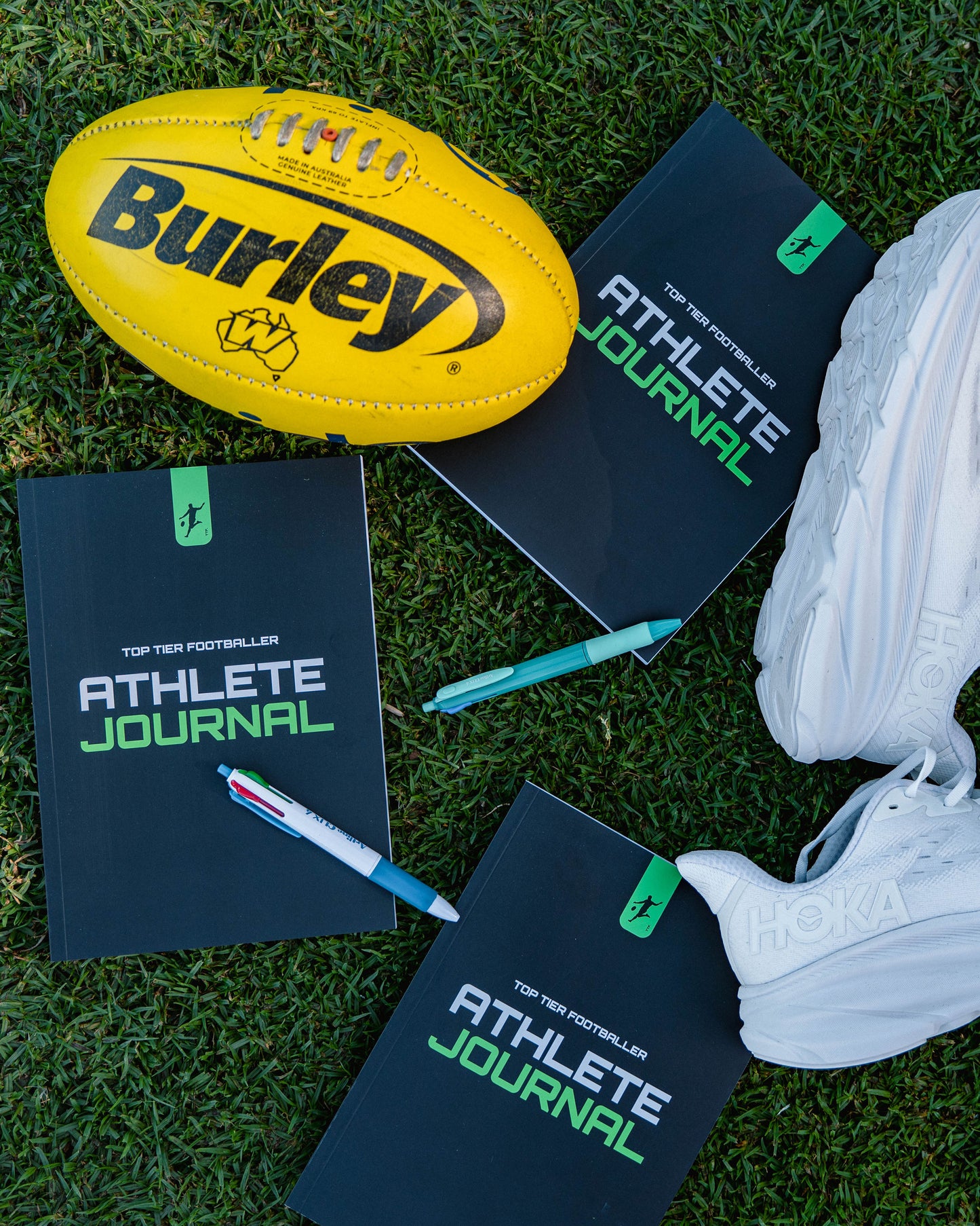 Football with sports journal and runners